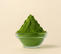 Okumidori matcha powder in a glass bowl