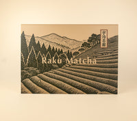 Raku Matcha Tasting Gift Box with an illustrated Uji tea field and mountains on the lid